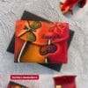 Billeteras artesanales de cuero con mariposas, hechas en Barranquilla, disponibles en colores surtidos, diseño exclusivo con caja de presentación.